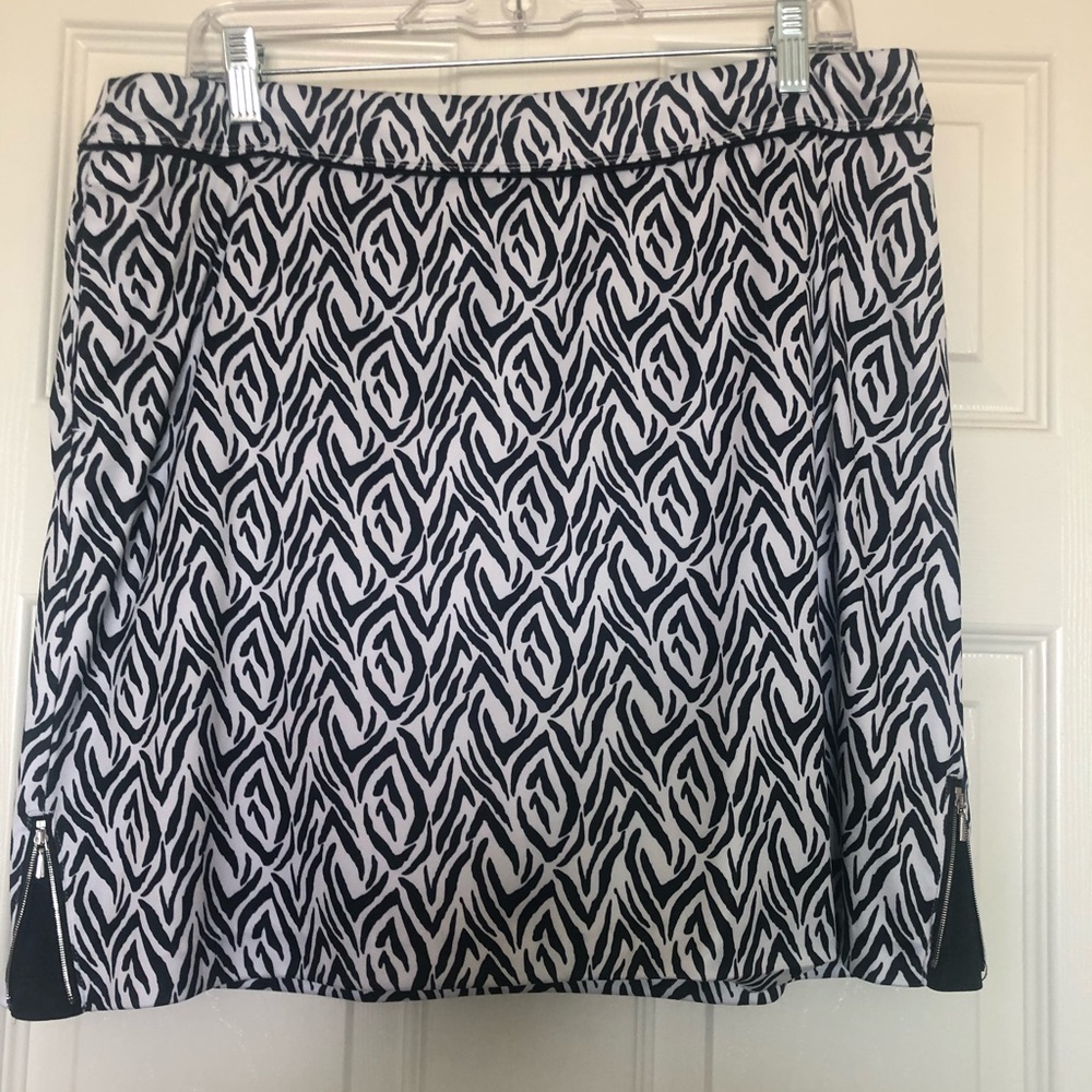 Greg Norman pull on zebra skort